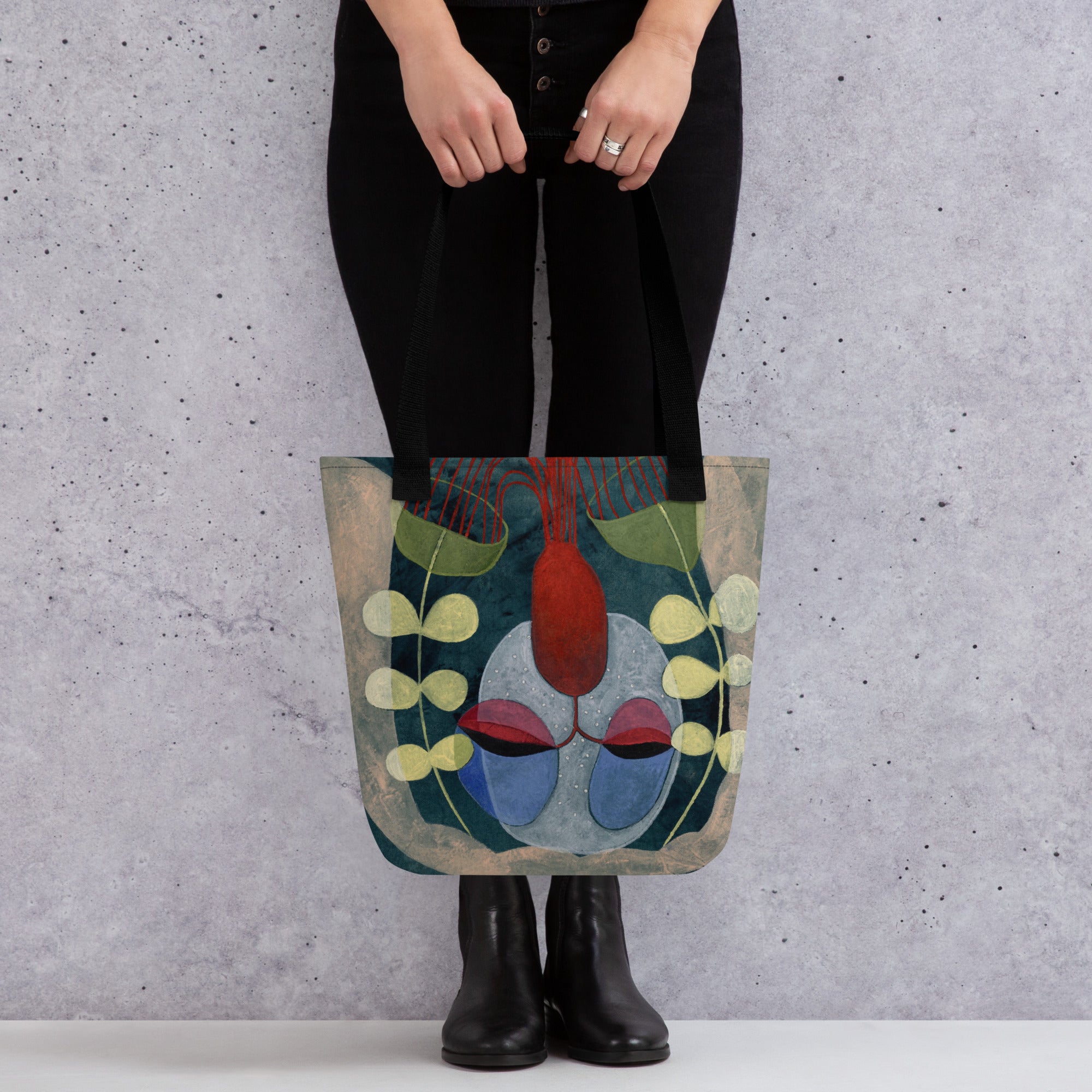 "Mockup des schwarzen 'Die Magische Küche' Tote Bags mit Baumwollgriffen"