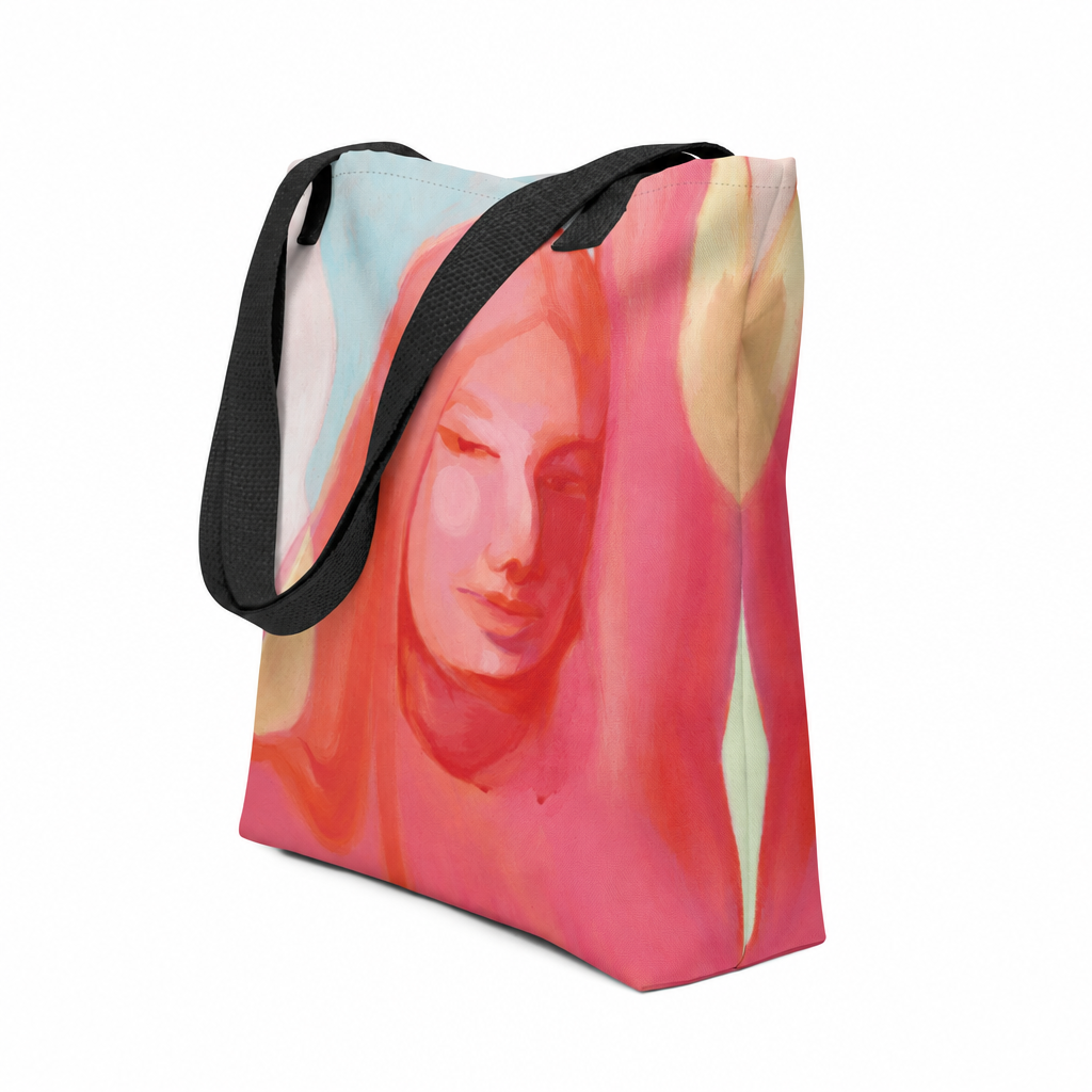 Tote Bag "Mensch Sein" von Claudia Pollack mit Frauenporträt in Rosa- und Koralltönen und schwarzen Griffen, schräge Vorderansicht.