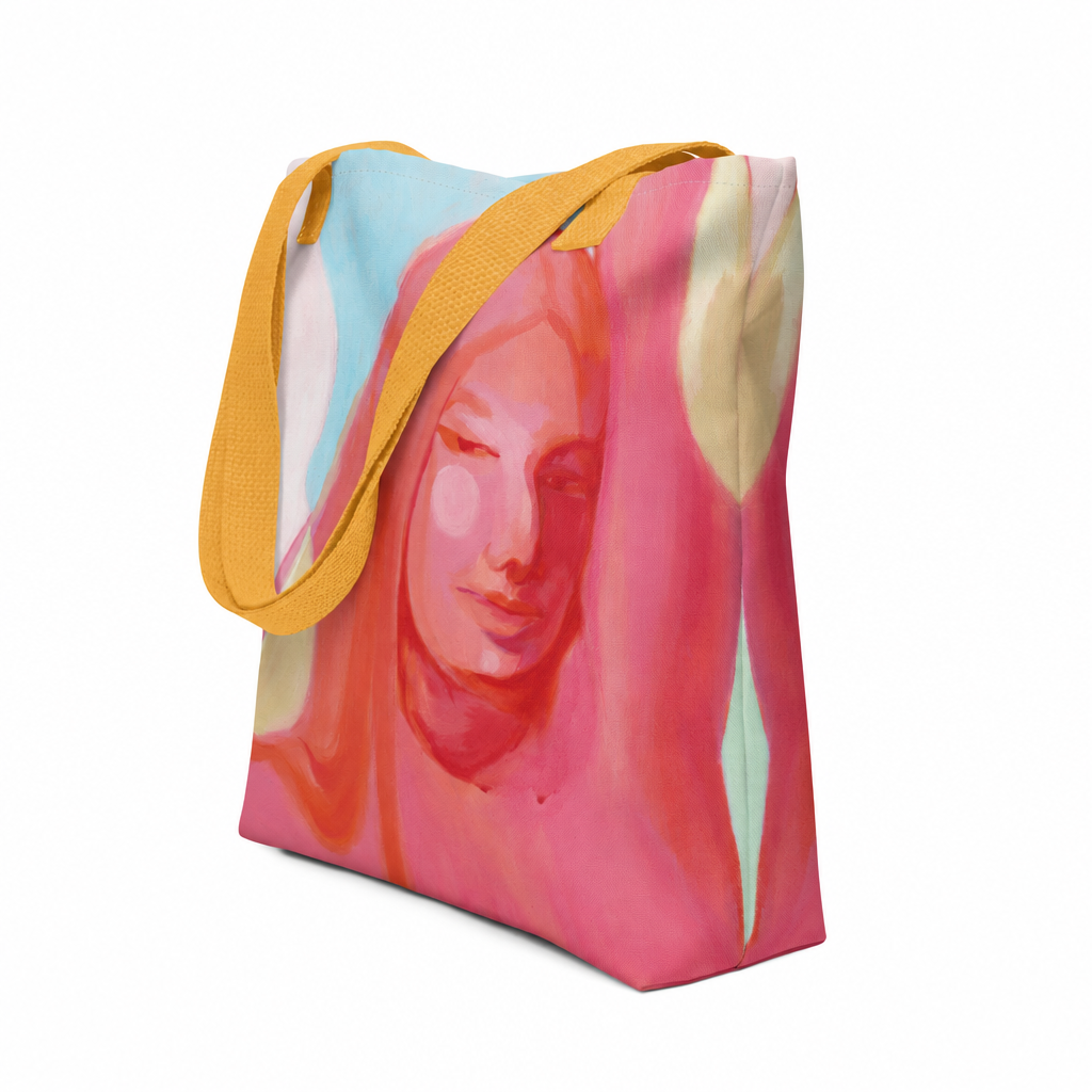 Tote Bag "Mensch Sein" von Claudia Pollack mit Frauenporträt in Rosa- und Koralltönen und gelben Griffen, schräge Vorderansicht.