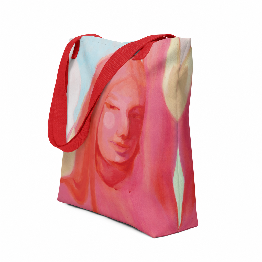 Tote Bag "Mensch Sein" von Claudia Pollack mit Frauenporträt in Rosa- und Koralltönen und roten Griffen, schräge Vorderansicht.